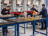 Engineering workshop with cable reel stand and electrical training benches