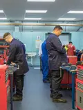 Engineering apprentices carrying out mechanical maintenance training